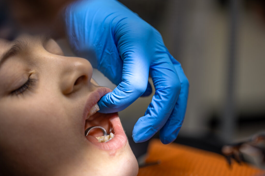 girl dentists office dentist examining child patients teeth dentistry concept