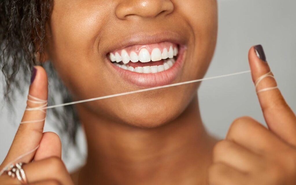 how to properly floss your teeth and why its important